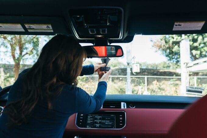 Woman adjusting her VAVA dash camera