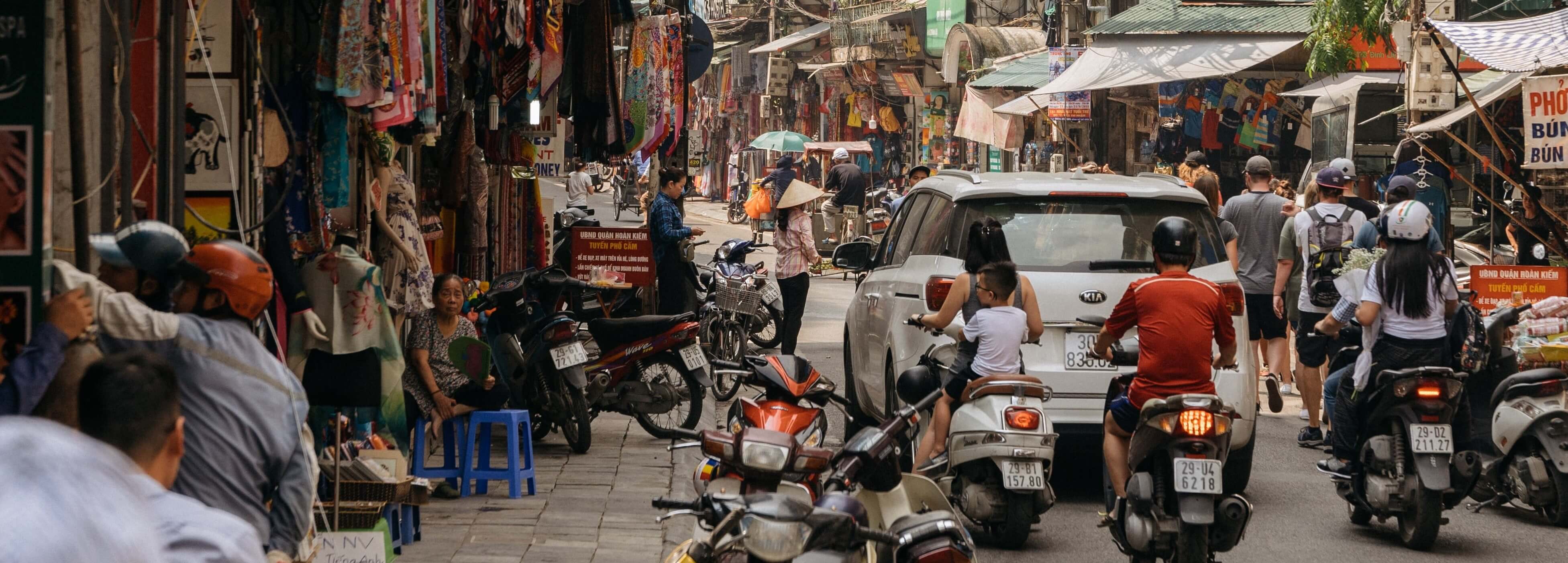 people sitting on sidewalk