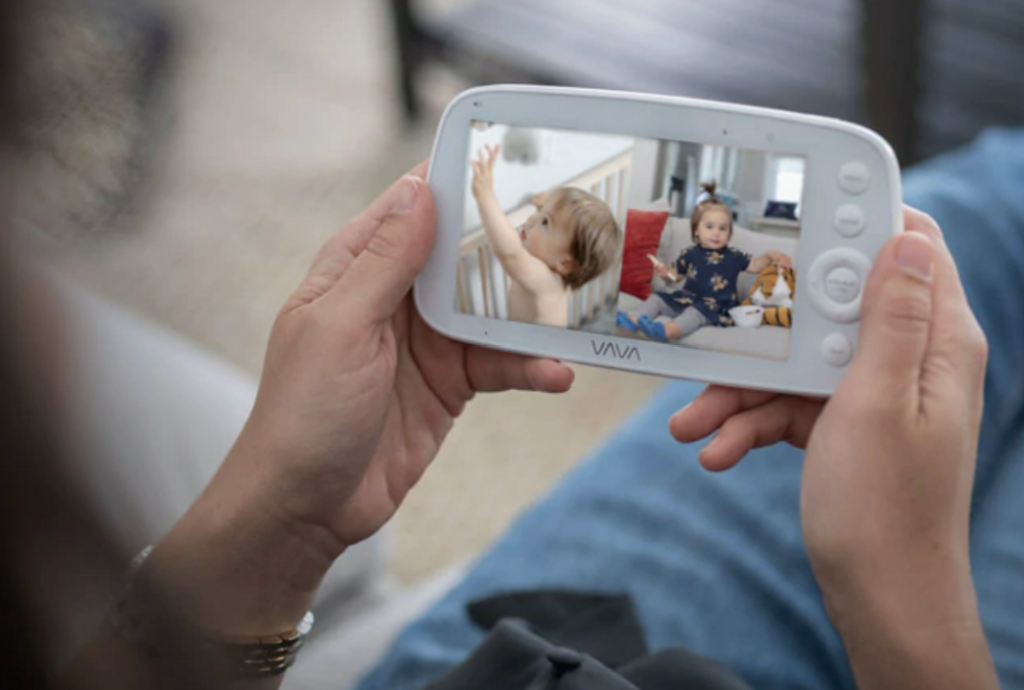 Caregiver holding a baby monitor